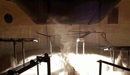Internal view of the solar receiver when the fluidization is active / When Fluidized, a bed of solid particles will behave as a fluid Internal view of the solar receiver when the fluidization is active / When Fluidized, a bed of solid particles will behave as a fluid